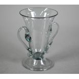 A Georgian smokey jelly glass with twin scroll handles, on domed foot with folded rim, 10.5 cm