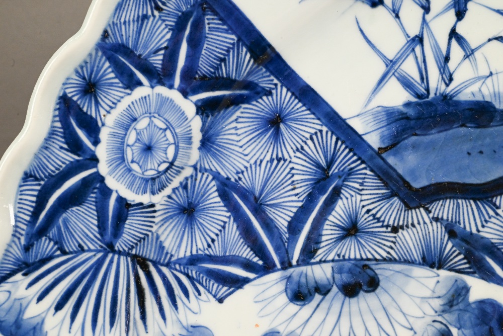 A 19th century Japanese blue and white floriform charger, painted with a goose and bamboo within a - Image 4 of 10