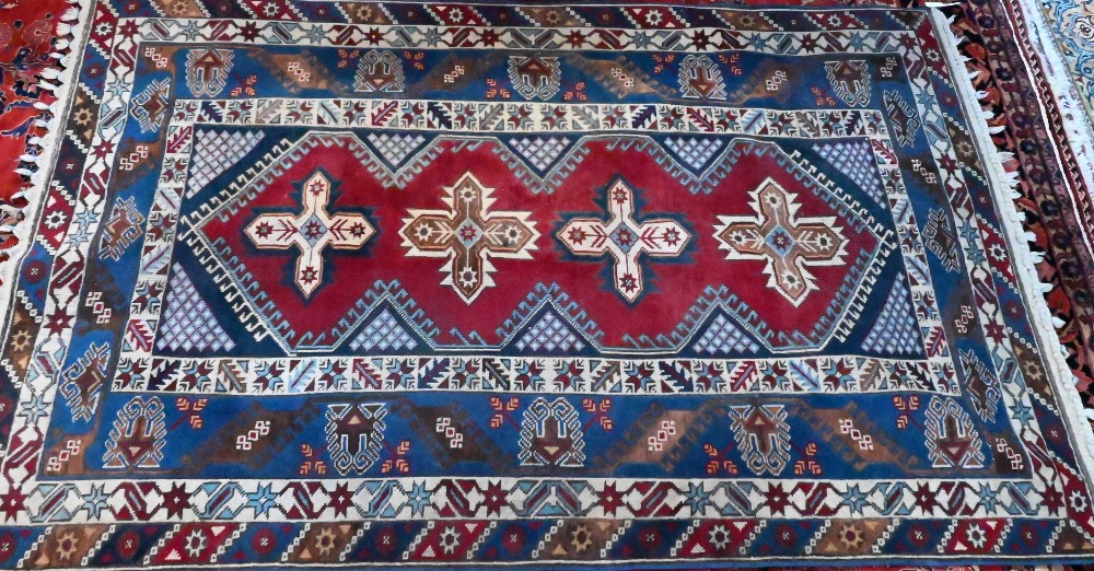 A contemporary Turkish rug, the blue ground with diamond pole design, mid 20th century, 230 cm x 152