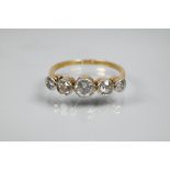 A graduated five stone diamond ring, size S, approx total diamond weight 1 ct, 18ct yellow gold