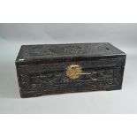 An early 20th century Chinese hardwood and camphor lined table top scholars chest, the exterior