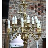 A good heavy cast brass electrolier in the Aesthetic taste, the twelve branches arranged in to