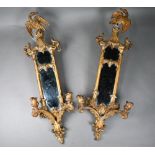 A pair of antique giltwood and gesso girandole mirrors, surmounted by ho-ho birds in the Chinese