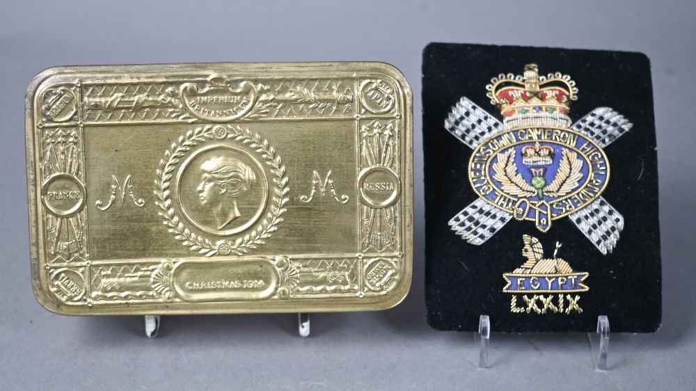 A WWI Queen Mary Christmas tin to/w a Cameron Highlanders officers swagger stick, cap badge and - Image 4 of 4