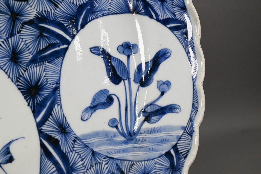 A 19th century Japanese blue and white floriform charger, painted with a goose and bamboo within a - Image 5 of 10