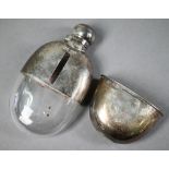 Late Victorian silver-clad oval glass hip-flask with hinged bayonet bun cover and detachable beaker,