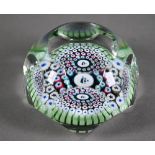 Whitefriars facetted glass millefiore cane paperweight, centred by a sailing ship, the date-cane