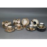 An early 20th century Japanese Satsuma part coffee service gilded and painted with Fuji landscapes