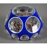 Baccarat glass blue flash and facetted paperweight with small millefiori inner display and star-