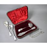 Victorian cased silver set of fiddle pattern serving flatware with foliate engraving, comprising