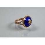 A Victorian ring of blue enamel domed design with inset star motif, 9ct yellow gold set, size P