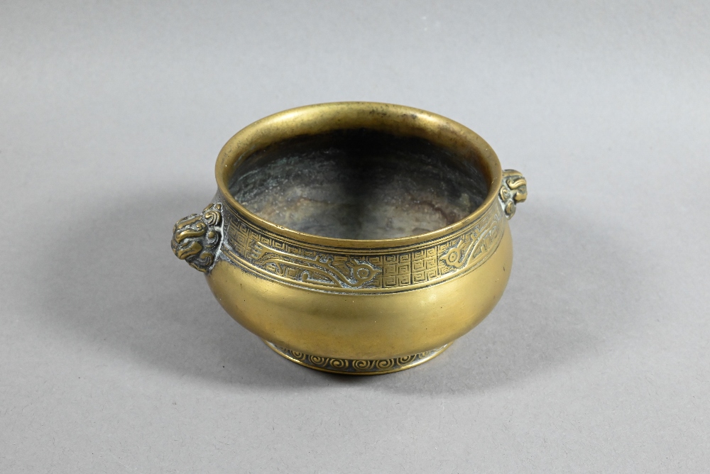 A 19th century Chinese bronze censer or incense burner of compressed globular form with cast - Image 2 of 8