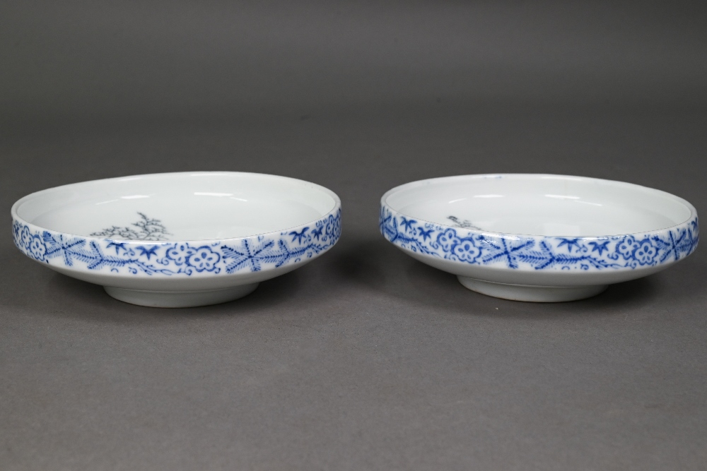 A pair of Japanese Arita blue and white bowls, Taisho/Showa period, the interiors painted in - Image 4 of 7