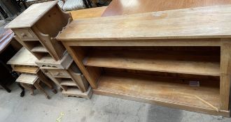 An oak bookcase together with a pair of pine bedside cabinets and a nest of three pine tables