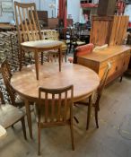 A G-Plan teak dining suite comprising an extending dining table,