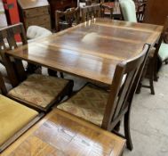 A 20th century oak drawleaf dining table together with a set of four dining chairs