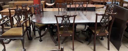 A George III style mahogany dining suite comprising an extending dining table and eight chairs