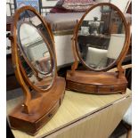 A pair of 20th century yew wood toilet mirrors with base drawers