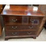 An Edwardian mahogany chest of rectangular form with three long drawers on bracket feet