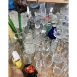 A large lot including storage jars, jardinieres, vases, drinking glasses,
