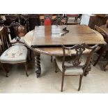 A set of four Edwardian mahogany salon chairs together with an oak extending dining table with