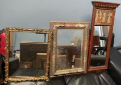 A gilt wall mirror with floral scrolling edge,