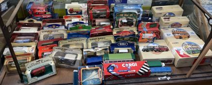 A collection of Corgi model buses together with models of Yesteryear and other boxed model vehicles