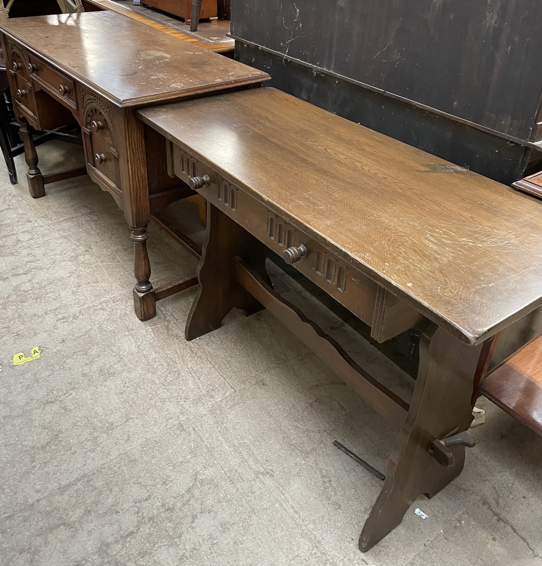 A 20th century oak side table with a rectangular top and a single drawer on stiles together with a