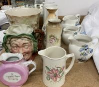 A Beswick Ware Sairey Gamp character jug together with a jardiniere, jugs,