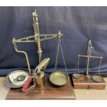 A brass table top scales with brass pans,