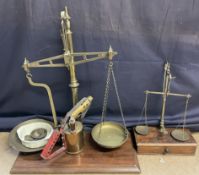 A brass table top scales with brass pans,
