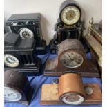 A black slate mantle clock,