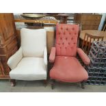 A Victorian oak framed Library chair with spindle and pad upholstered arms on turned legs together