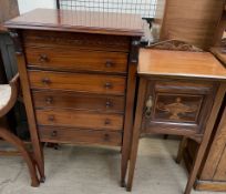 An early 20th century mahogany music cabinet with a rectangular top above five drawers on square