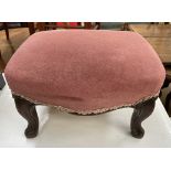 A small continental upholstered foot stool with a pad top on shaped legs