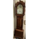 A 19th century mahogany Longcase clock the arched hood with three globe finials,