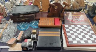 A chess board together with other games, cases, gavels,