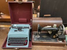 A Singer sewing machine in an ok case together with an Olivetti Studio 44 typewriter cased