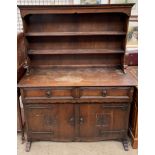 A 20th century oak kitchen dresser, with a moulded cornice and two shelves,