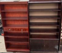 A reproduction mahogany bookcase together with another reproduction bookcase