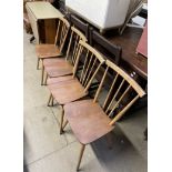 A set of four Ercol stick back dining chairs together with a melamine topped kitchen table