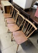 A set of four Ercol stick back dining chairs together with a melamine topped kitchen table