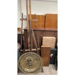 Two easels together with a brass wall plaque,