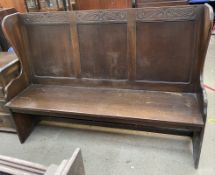 A 20th century oak settle,