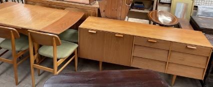 A mid 20th century Avolon dining suite comprising a table,