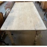 A pine refectory table, the planked top with rounded corners on turned legs, 91cm wide x 231.