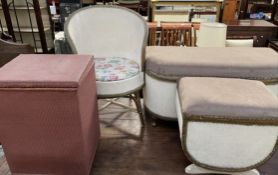 A cream painted ottoman together with a matching laundry basket and chair and a pink wicker laundry