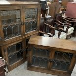 A set of four oak bookcases with leaded glass doors