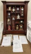 A collection of Franklin Mint clocks from the Collectors Treasury of Clocks,