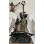 A Russian cast iron model of a setter together with two cold painted spelter figures of dogs,